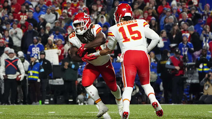 Nov 17, 2024; Orchard Park, New York, USA; Kansas City Chiefs quarterback Patrick Mahomes (15) hands the ball off to Kansas City Chiefs running back Kareem Hunt (29) against the Buffalo Bills during the second half at Highmark Stadium. Mandatory Credit: Gregory Fisher-Imagn Images