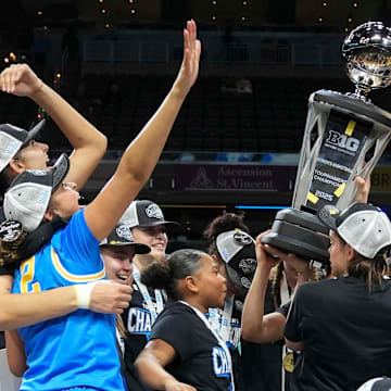 UCLA Bruins players celebrate after defeating the USC Trojans during the 2025 TIAA Big Ten Women's Basketball Tournament final on Sunday, March 9, 2025, at Gainbridge Fieldhouse in Indianapolis. UCLA defeated USC 72-67.