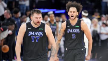 Dallas Mavericks guard Luka Doncic (77) and center Dereck Lively II (2) celebrate.