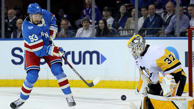Pittsburgh Penguins goaltender Arturs Silovs, New York Rangers center Mika Zibanejad 