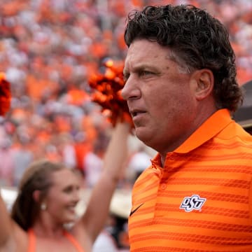 Oklahoma State head football coach Mike Gundy runs onto the field in the first half of the college football game between the Oklahoma State Cowboys and South Dakota State Jackrabbits at Boone Pickens Stadium in Stillwater, Okla., Saturday, Aug., 31, 2024.