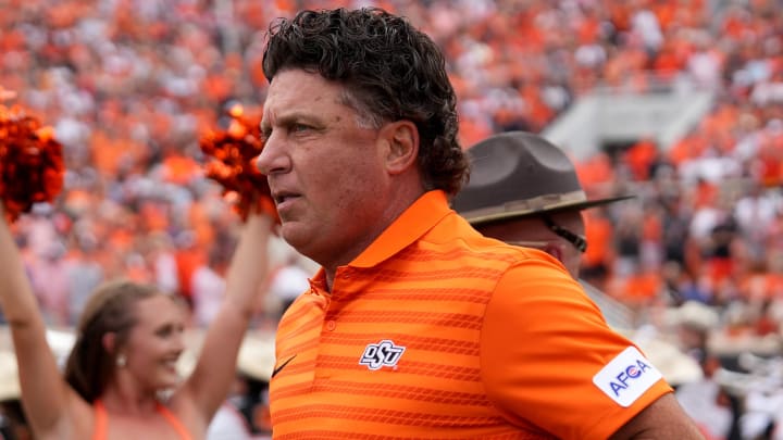 Oklahoma State head football coach Mike Gundy runs onto the field in the first half of the college football game between the Oklahoma State Cowboys and South Dakota State Jackrabbits at Boone Pickens Stadium in Stillwater, Okla., Saturday, Aug., 31, 2024.