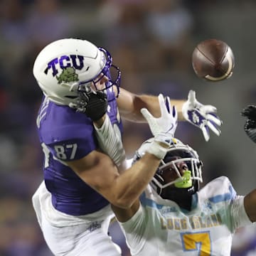 Sep 7, 2024; Fort Worth, Texas, USA; TCU Horned Frogs wide receiver Blake Nowell (87) cannot catch a pass while defended by Long Island Sharks defensive back Nate Wyatt (7) in the second half at Amon G. Carter Stadium. Mandatory Credit: Tim Heitman-Imagn Images