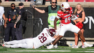 Louisville Cardinals wide receiver Shaun Boykins Jr. (89) runs for a gain after a catch as Eastern Kentucky Colonels linebacker Cam Jessee (39) tries to defend in the second half as the Cards rolled past Eastern Kentucky University 51-17 at the Cardinals' season opener Saturday, August 30, 2025 at L&N Federal Credit Union Stadium in Louisville, Kentucky.