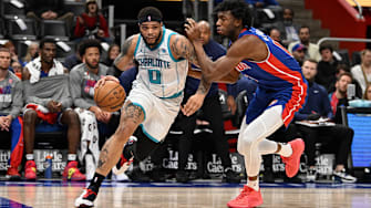 Mar 11, 2024; Detroit, Michigan, USA;  Charlotte Hornets forward Miles Bridges (0) drives to the basket past Detroit Pistons center James Wiseman (13) in the first quarter at Little Caesars Arena. Mandatory Credit: Lon Horwedel-Imagn Images