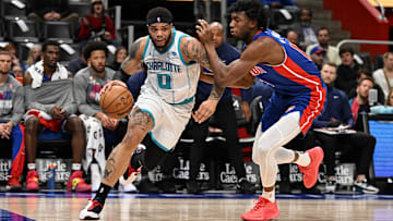 Mar 11, 2024; Detroit, Michigan, USA;  Charlotte Hornets forward Miles Bridges (0) drives to the basket past Detroit Pistons center James Wiseman (13) in the first quarter at Little Caesars Arena. Mandatory Credit: Lon Horwedel-Imagn Images