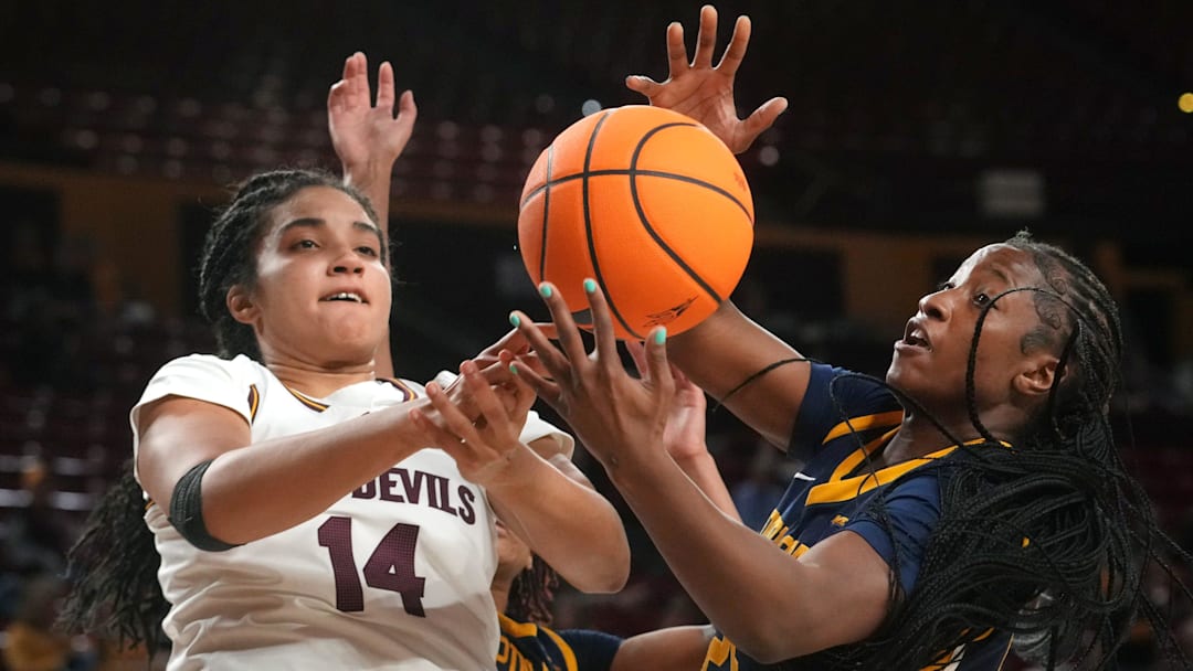 ASU Sun Devils forward Heloisa Carrera (14) fights for a rebound with Coppin State Bald Eagles forward Shanaii Gamble (25) at Desert Financial Arena on Nov. 3, 2025.