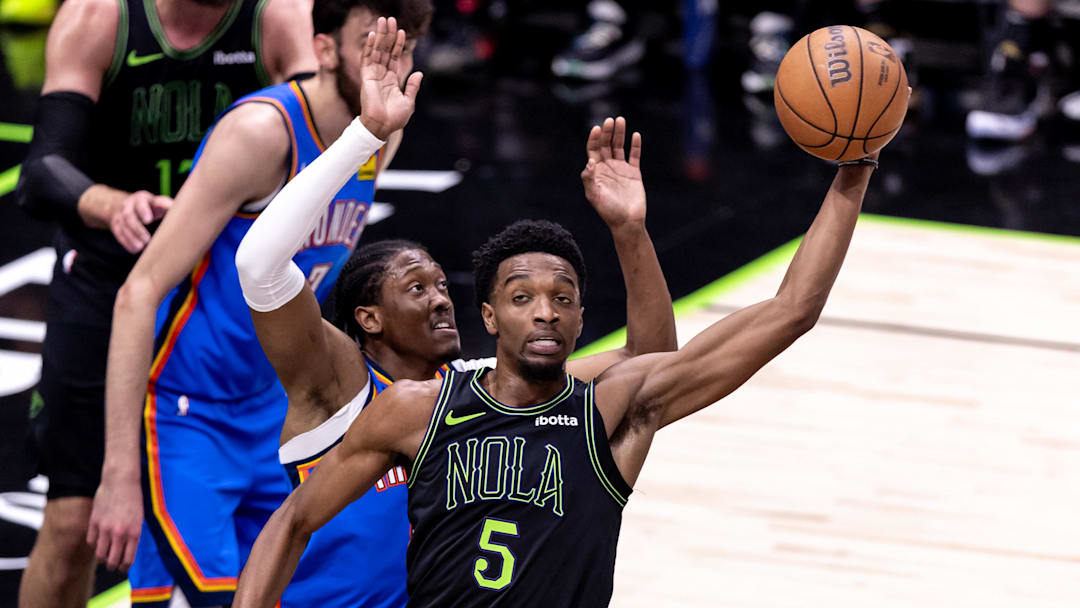 Apr 29, 2024; New Orleans, Louisiana, USA; New Orleans Pelicans forward Herbert Jones (5) passes the ball against Oklahoma City Thunder forward Jalen Williams (8) during game four of the first round for the 2024 NBA playoffs at Smoothie King Center.