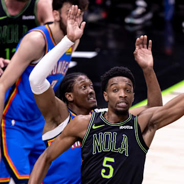 Apr 29, 2024; New Orleans, Louisiana, USA; New Orleans Pelicans forward Herbert Jones (5) passes the ball against Oklahoma City Thunder forward Jalen Williams (8) during game four of the first round for the 2024 NBA playoffs at Smoothie King Center.