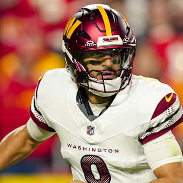 Oct 27, 2025; Kansas City, Missouri, USA; Washington Commanders quarterback Marcus Mariota (8) rolls out to pass during the first half against the Kansas City Chiefs at GEHA Field at Arrowhead Stadium. Mandatory Credit: Jay Biggerstaff-Imagn Images