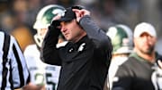 Nov 22, 2025; Iowa City, Iowa, USA; Michigan State Spartans head coach Jonathan Smith talks with an official during the second quarter against the Michigan State Spartans at Kinnick Stadium.