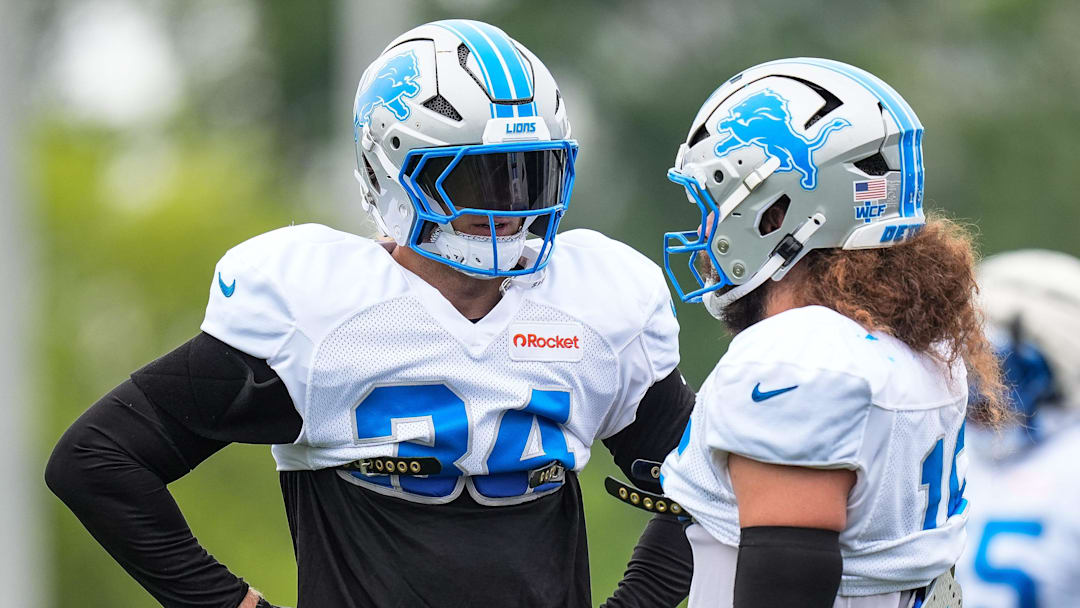 Detroit Lions linebackers Alex Anzalone (34) and Grant Stuard (15) talk during training camp at Meijer Performance Center in Allen Park on Saturday, July 26, 2025.