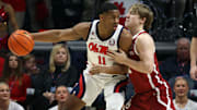 Mar 1, 2025; Oxford, Mississippi, USA; Mississippi Rebels guard Matthew Murrell (11) dribbles as Oklahoma Sooners guard Dayton Forsythe (7) defends during the first half at The Sandy and John Black Pavilion at Ole Miss. Mandatory Credit: Petre Thomas-Imagn Images