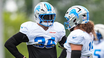 Detroit Lions linebackers Alex Anzalone (34) and Grant Stuard (15) talk during training camp at Meijer Performance Center in Allen Park on Saturday, July 26, 2025.