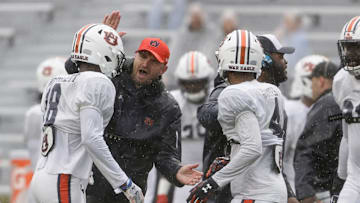 Apr 8, 2023; Auburn, AL, USA;  Auburn Tigers linebackers coach Josh Aldridge celebrates with cornerback Nehemiah Pritchett (18) during the annual Auburn Spring Game at Jordan-Hare Stadium. Mandatory Credit: John Reed-Imagn Images