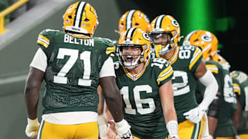 Aug 9, 2025; Green Bay, Wisconsin, USA;  Green Bay Packers quarterback Sean Clifford (16) reacts to a touchdown with offensive tackle Anthony Belton (71) during the second half against the New York Jets at Lambeau Field. Mandatory Credit: Kayla Wolf-Imagn Images