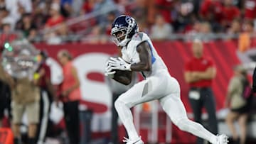 Aug 9, 2025; Tampa, Florida, USA; Tennessee Titans wide receiver Calvin Ridley (0) runs with the ball against the Tampa Bay Buccaneers in the second quarter during a preseason game at Raymond James Stadium. Mandatory Credit: Nathan Ray Seebeck-Imagn Images