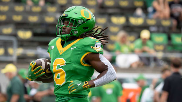 dan lanning oregon ducks northwestern wildcats oklahoma state cowboys dante moore quarterback running backs wide receiver