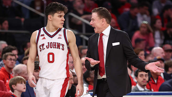 Jan 3, 2026; New York, New York, USA;  St. John's basketball head coach Rick Pitino talks with guard Dylan Darling (0) in the second half against the Providence Friars at Madison Square Garden