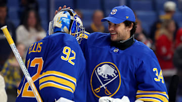 Oct 22, 2025; Buffalo, New York, USA;  Buffalo Sabres goaltender Colten Ellis (92) celebrates his first NHL win against the Detroit Red Wings with goaltender Alex Lyon (34) at KeyBank Center. Mandatory Credit: Timothy T. Ludwig-Imagn Images