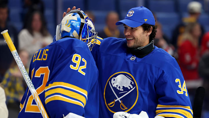 Oct 22, 2025; Buffalo, New York, USA;  Buffalo Sabres goaltender Colten Ellis (92) celebrates his first NHL win against the Detroit Red Wings with goaltender Alex Lyon (34) at KeyBank Center. Mandatory Credit: Timothy T. Ludwig-Imagn Images