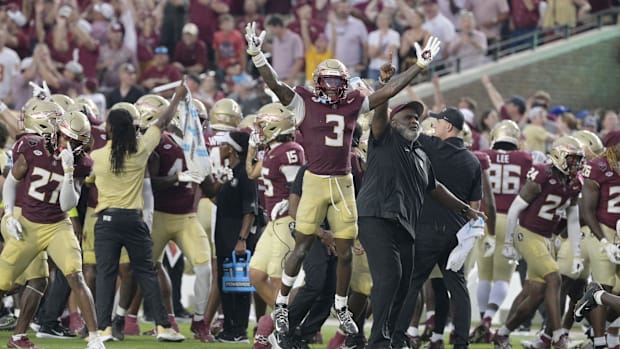 Florida State Seminoles running back Kam Davis (3) and associate head coach Odell Haggins
