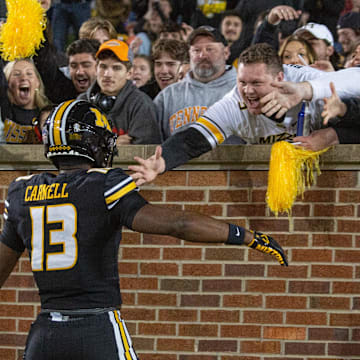 Nov 11, 2023; Columbia, Missouri, USA; Missouri Tigers defensive back Daylan Carnell (13) celebrates with fans after returning an interception for a touchdown in the fourth quarter at Faurot Field at Memorial Stadium. Mandatory Credit: Kylie Graham-USA TODAY Sports