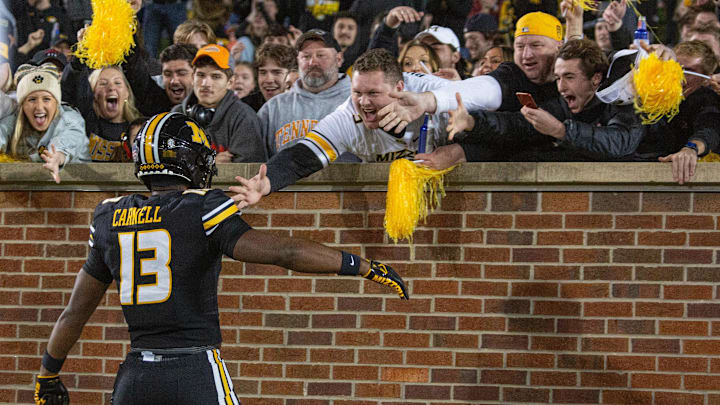 Nov 11, 2023; Columbia, Missouri, USA; Missouri Tigers defensive back Daylan Carnell (13) celebrates with fans after returning an interception for a touchdown in the fourth quarter at Faurot Field at Memorial Stadium. Mandatory Credit: Kylie Graham-USA TODAY Sports