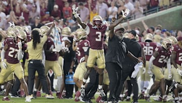 Aug 30, 2025; Tallahassee, Florida, USA; Florida State Seminoles running back Kam Davis (3) and associate head coach Odell Haggins react after a play Alabama Crimson Tide during the second half at Doak S. Campbell Stadium. Mandatory Credit: Melina Myers-Imagn Images