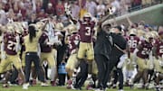 Florida State Seminoles running back Kam Davis and associate head coach Odell Haggins react after a play Alabama Crimson Tide.