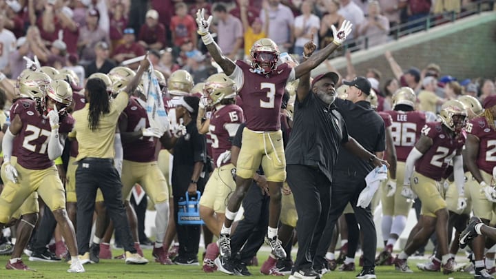 Florida State Seminoles running back Kam Davis and associate head coach Odell Haggins react after a play Alabama Crimson Tide. Florida State Seminoles running back Kam Davis and associate head coach Odell Haggins react after a play Alabama Crimson Tide.