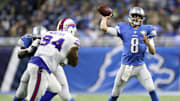 ESPN analyst and former Detroit Lions quarterback Dan Orlovsky throws the ball against the Buffalo Bills in an NFL game