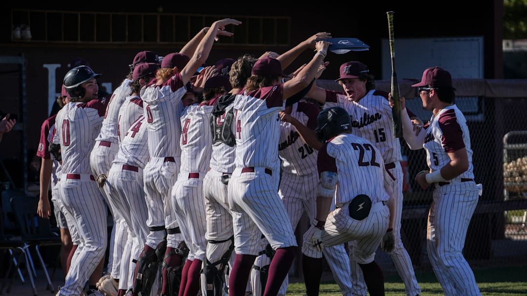 Hamilton High School’s Boston Kellner (22), right, celebrates after hitting a home run against Basha High School during the fourth inning at Hamilton High School in Chandler on April 4, 2024.