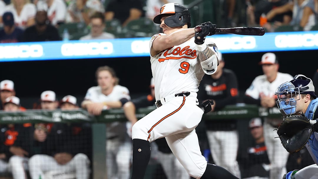 Sep 23, 2025; Baltimore, Maryland, USA; Baltimore Orioles outfielder Tyler O'Neill (9) drives in a run during the first inning against the Tampa Bay Rays at Oriole Park at Camden Yards. Mandatory Credit: Daniel Kucin Jr.-Imagn Images