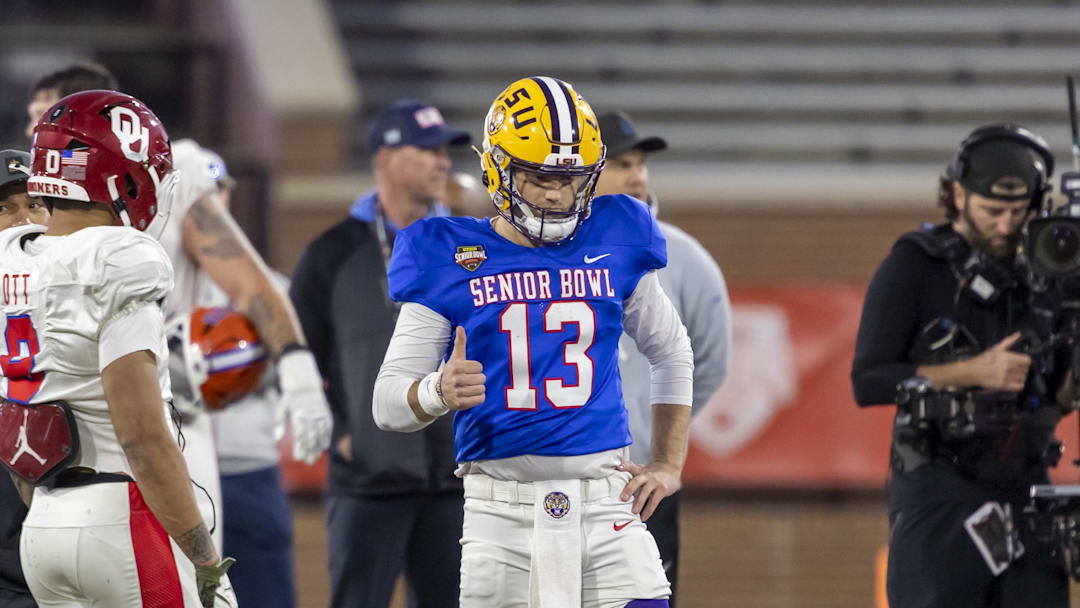 Jan 28, 2026; Mobile, AL, USA; American Team quarterback Garrett Nussmeier (13) of LSU gives a thumbs up during American Senior Bowl practice at Hancock Whitney Stadium. Mandatory Credit: Vasha Hunt-Imagn Images