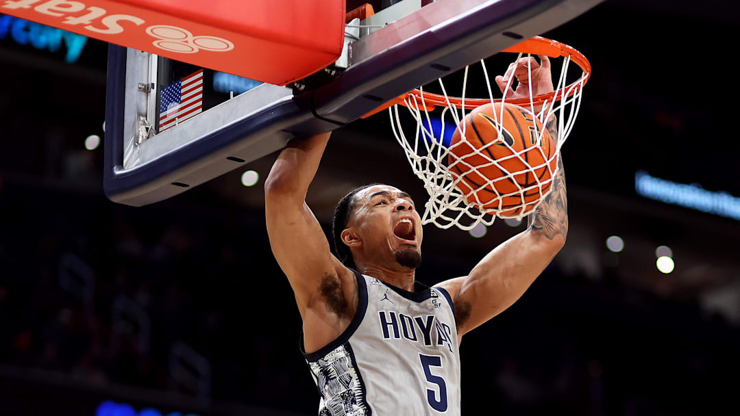 Feb 19, 2025; Washington, District of Columbia, USA; Georgetown Hoyas guard Micah Peavy (5) dunks during the first half against the Providence Friars at Capital One Arena. Mandatory Credit: Daniel Kucin Jr.-Imagn Images