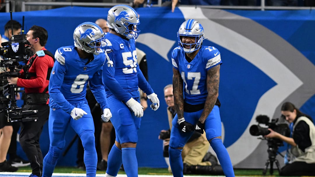Dec 5, 2024; Detroit, Michigan, USA;  Detroit Lions wide receiver Tim Patrick (17) celebrates with offensive tackle Penei Sewell (58) and wide receiver Allen Robinson (8)after catching a touchdown pass against the Green Bay Packers in the third quarter at Ford Field. Mandatory Credit: Lon Horwedel-Imagn Images