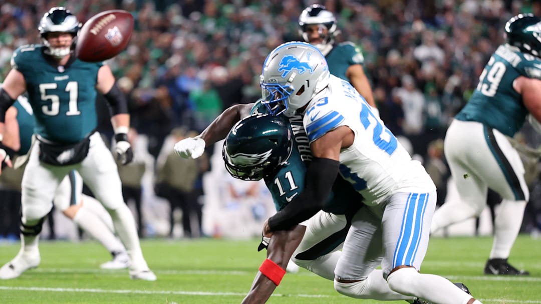 Nov 16, 2025; Philadelphia, Pennsylvania, USA; Philadelphia Eagles wide receiver A.J. Brown (11) attempts to make a catch over Detroit Lions cornerback Rock Ya-Sin (23) during the first half at Lincoln Financial Field. Mandatory Credit: Bill Streicher-Imagn Images
