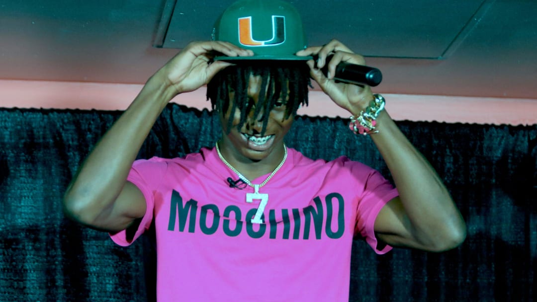 Lakeland's Cormani McClain puts on the baseball cap after choosing Miami.

102722 Rf Mcclain