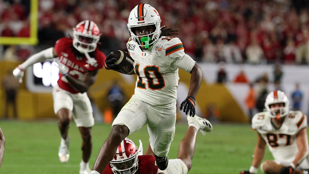 Jan 19, 2026; Miami Gardens, FL, USA; Miami Hurricanes wide receiver Malachi Toney (10) rushes the ball for a touchdown against the Indiana Hoosiers in the second half during the College Football Playoff National Championship game at Hard Rock Stadium. Mandatory Credit: Nathan Ray Seebeck-Imagn Images