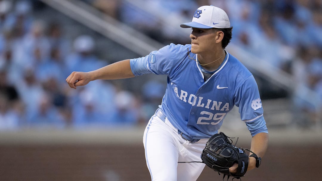 Jun 8, 2024; Chapel Hill, NC, USA; North Carolina Tar Heels Jason DeCaro (29) pitches against the West Virginia Mountaineers in the first inning of the DI Baseball Super Regional at Boshamer Stadium. Mandatory Credit: Jeffrey Camarati-Imagn Images

