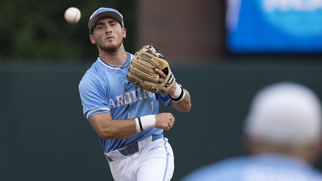 Jun 3, 2024; Chapel Hill, NC, USA;  North Carolina Tar Heels Alex Madera (1) makes a throw to first base for an out against the Louisiana State Tigers during the Div. I NCAA baseball regional at Boshamer Stadium.  Mandatory Credit: Jeffrey Camarati-Imagn Images
