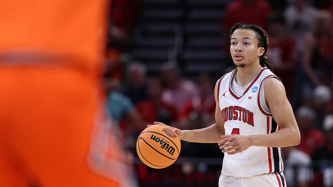 Mar 26, 2026; Houston, TX, USA; Houston Cougars guard Kingston Flemings (4) dribbles the ball against the Illinois Fighting Illini in the first half during a Sweet Sixteen game of the South Regional of the men's 2026 NCAA Tournament at Toyota Center. Mandatory Credit: Troy Taormina-Imagn Images