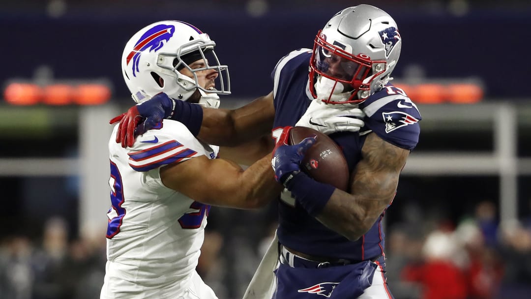 Dec 21, 2019; Foxborough, Massachusetts, USA; New England Patriots wide receiver N'Keal Harry (15) tries to break free from Buffalo Bills outside linebacker Matt Milano (58) during the first quarter at Gillette Stadium. Mandatory Credit: Winslow Townson-USA TODAY Sports