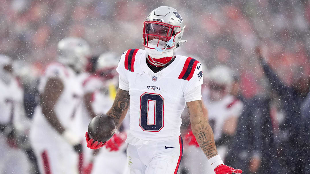 Jan 25, 2026; Denver, CO, USA; New England Patriots cornerback Christian Gonzalez (0) reacts after an interception against the Denver Broncos  during the second half in the 2026 AFC Championship Game at Empower Field at Mile High. Mandatory Credit: Ron Chenoy-Imagn Images