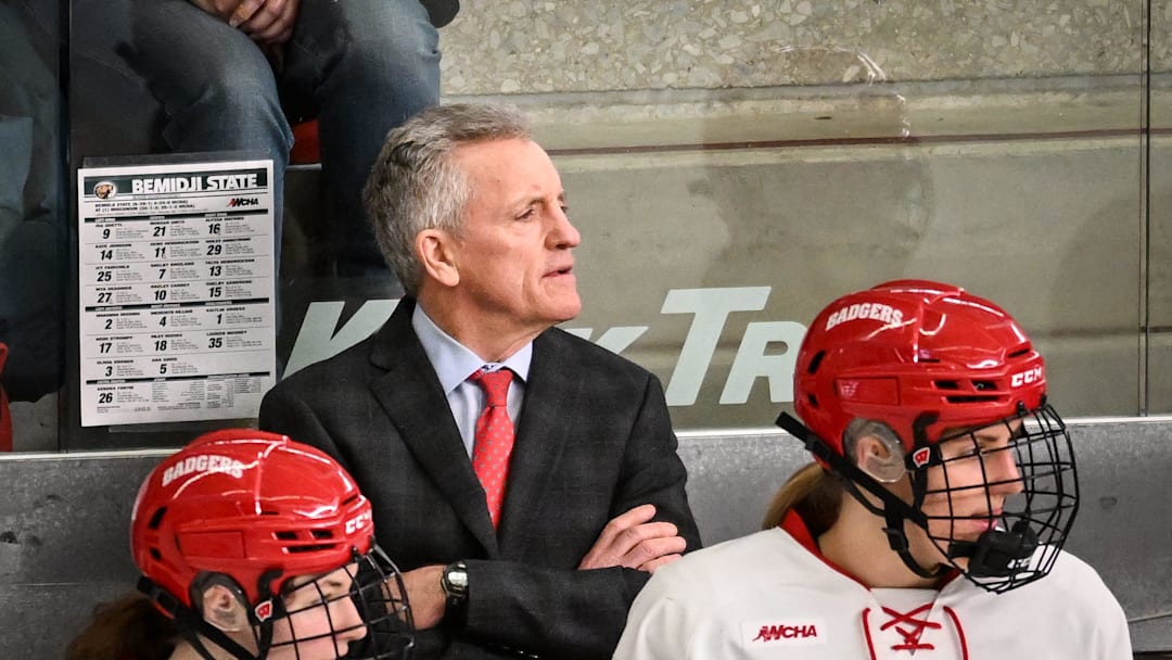Wisconsin Badgers head coach Mark Johnson and players watch the action in the second period of a WCHA first-round game against the Bemidji State Beavers on Saturday, March 1, 2025, at LaBahn Arena in Madison, Wisconsin.
