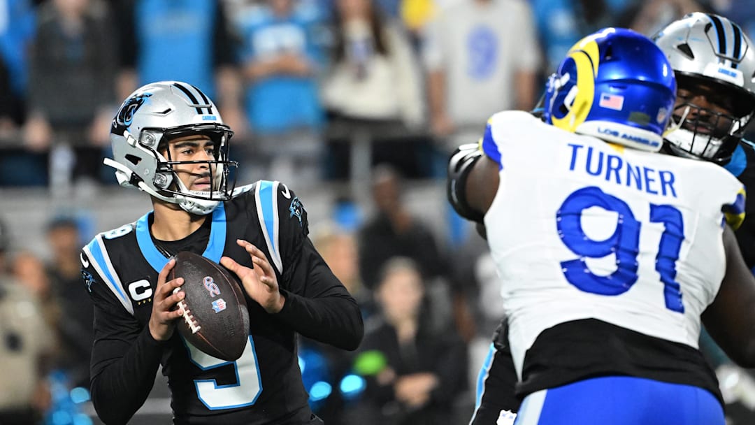 Jan 10, 2026; Charlotte, NC, USA; Carolina Panthers quarterback Bryce Young (9) drops back to pass against the Los Angeles Rams in the first half during the NFC Wild Card Round game at Bank of America Stadium. Mandatory Credit: Bob Donnan-Imagn Images