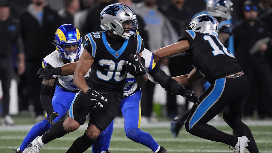 Jan 10, 2026; Charlotte, NC, USA; Carolina Panthers running back Chuba Hubbard (30) rushes the ball against the Los Angeles Rams in the second half during the NFC Wild Card Round game at Bank of America Stadium. Mandatory Credit: Jim Dedmon-Imagn Images