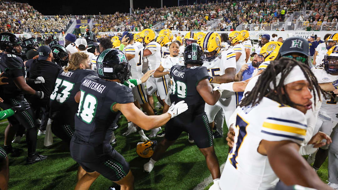A fight breaks out between the California Golden Bears and Hawaii Rainbow Warriors players at the end of the Hawaii Bowl