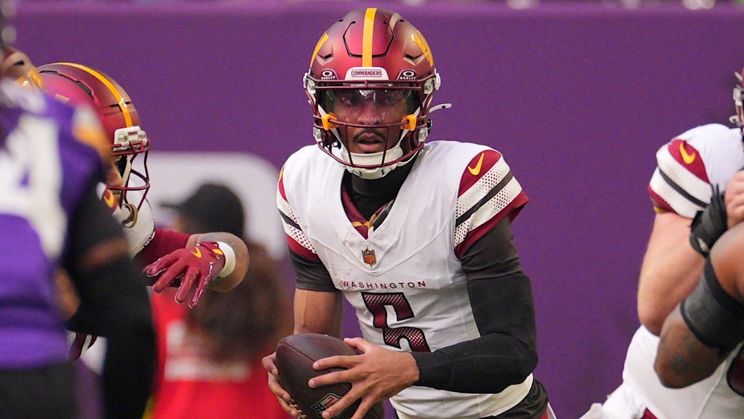 Dec 7, 2025; Minneapolis, Minnesota, USA; Washington Commanders quarterback Jayden Daniels (5) drops back to pass against the Minnesota Vikings during the first half at U.S. Bank Stadium. Mandatory Credit: Brad Rempel-Imagn Images